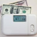 Thermostat displaying 67 degrees Fahrenheit with U.S. currency, symbolizing energy savings and HVAC efficiency for homeowners.