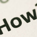 Close-up of printed text saying "HOW TO," relevant to HVAC maintenance tips and service guidance.