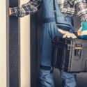 HVAC technician in uniform holding a toolbox, ready to provide heating and air conditioning services in DeBary, FL.