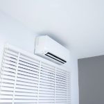 Ductless mini-split air conditioning unit mounted on a wall, providing efficient cooling for residential spaces, relevant to HVAC solutions discussed by Mid Florida A/C.