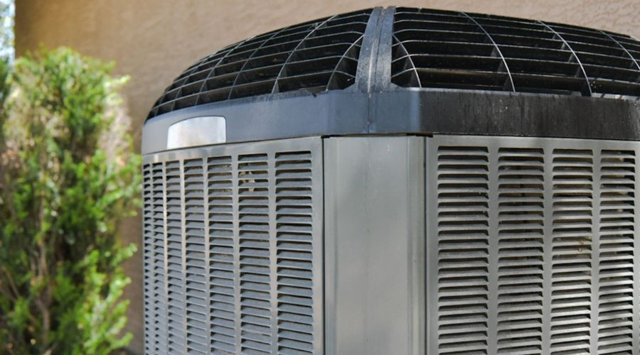 Air conditioning unit outdoors, showcasing cooling system features, relevant to air conditioning replacement and installation services.